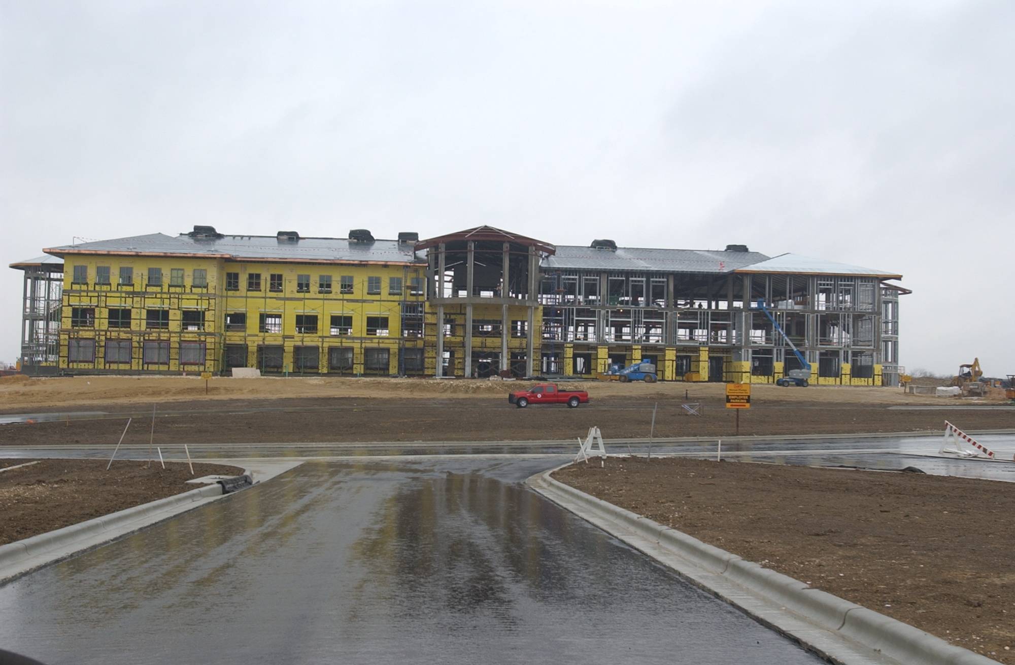 exterior photo of a large multi-story building being built