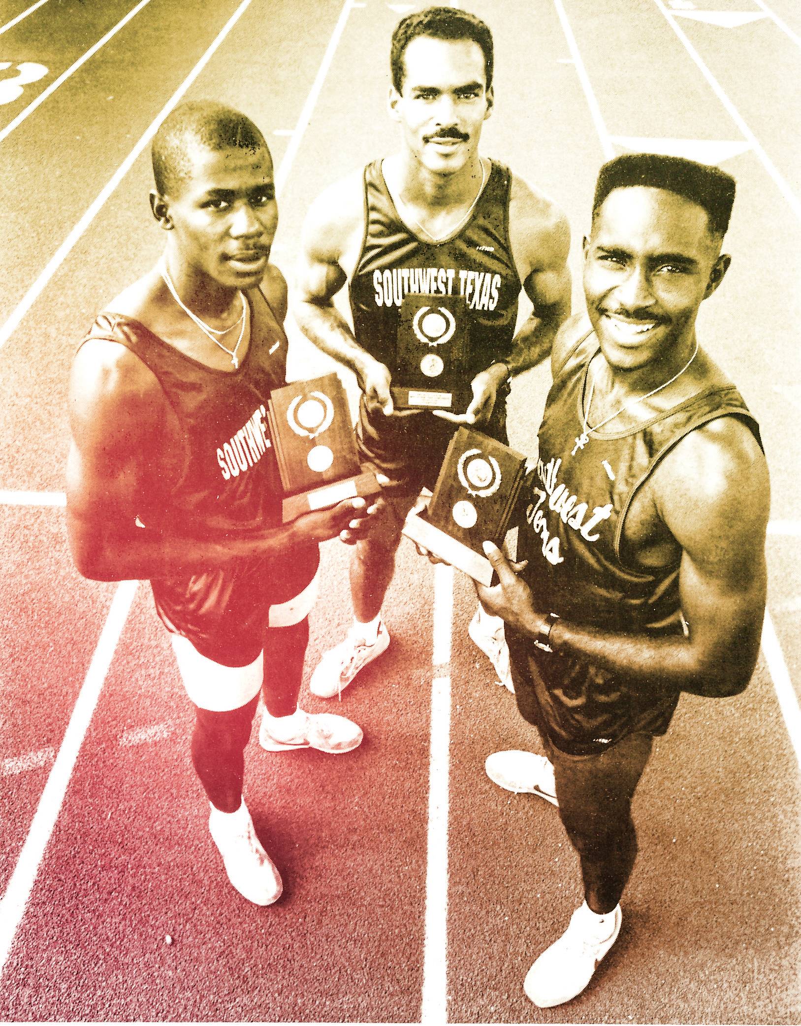 charles austin and three sprinters on a track