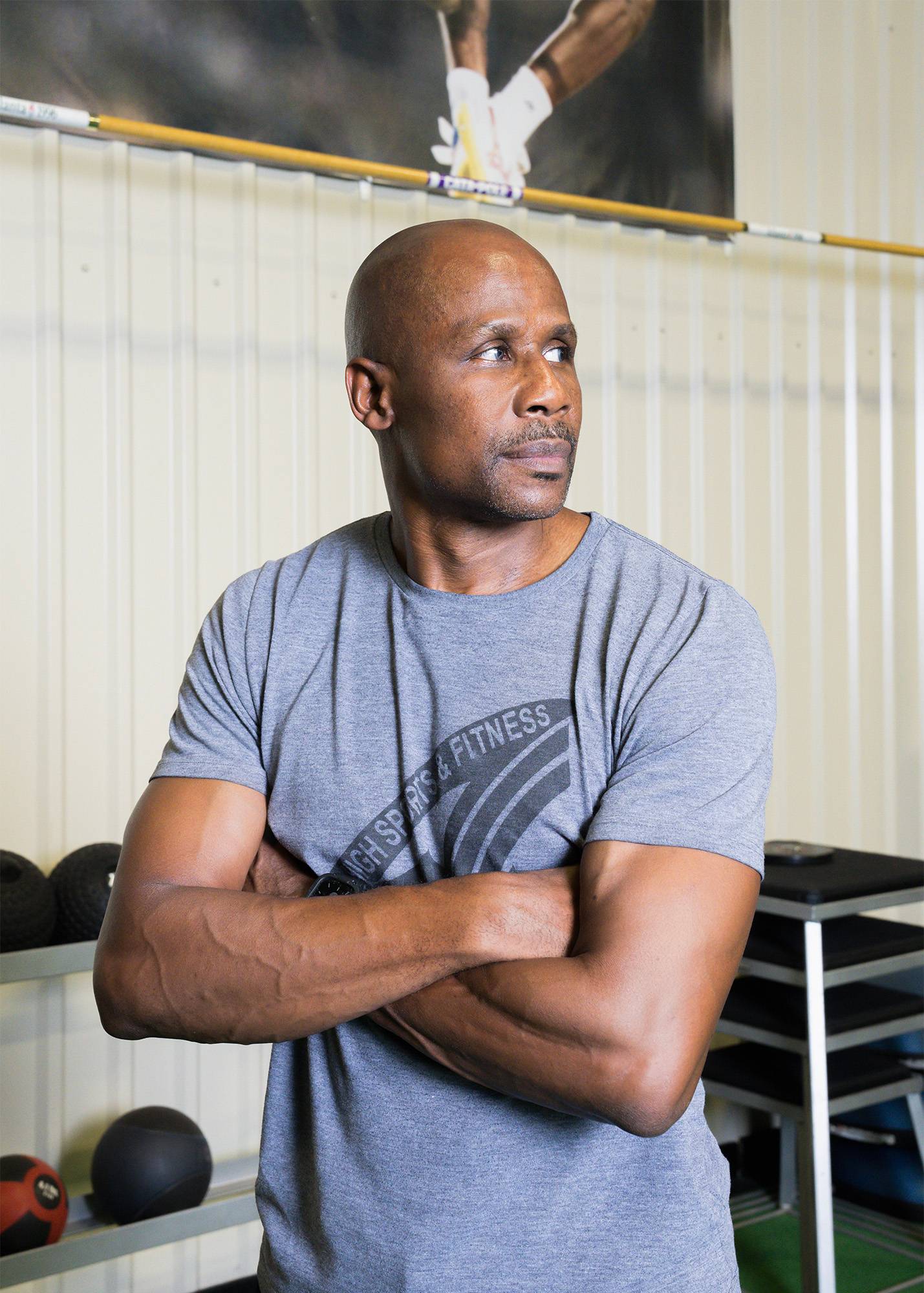 Charles Austin poses for a portrait at his gym.