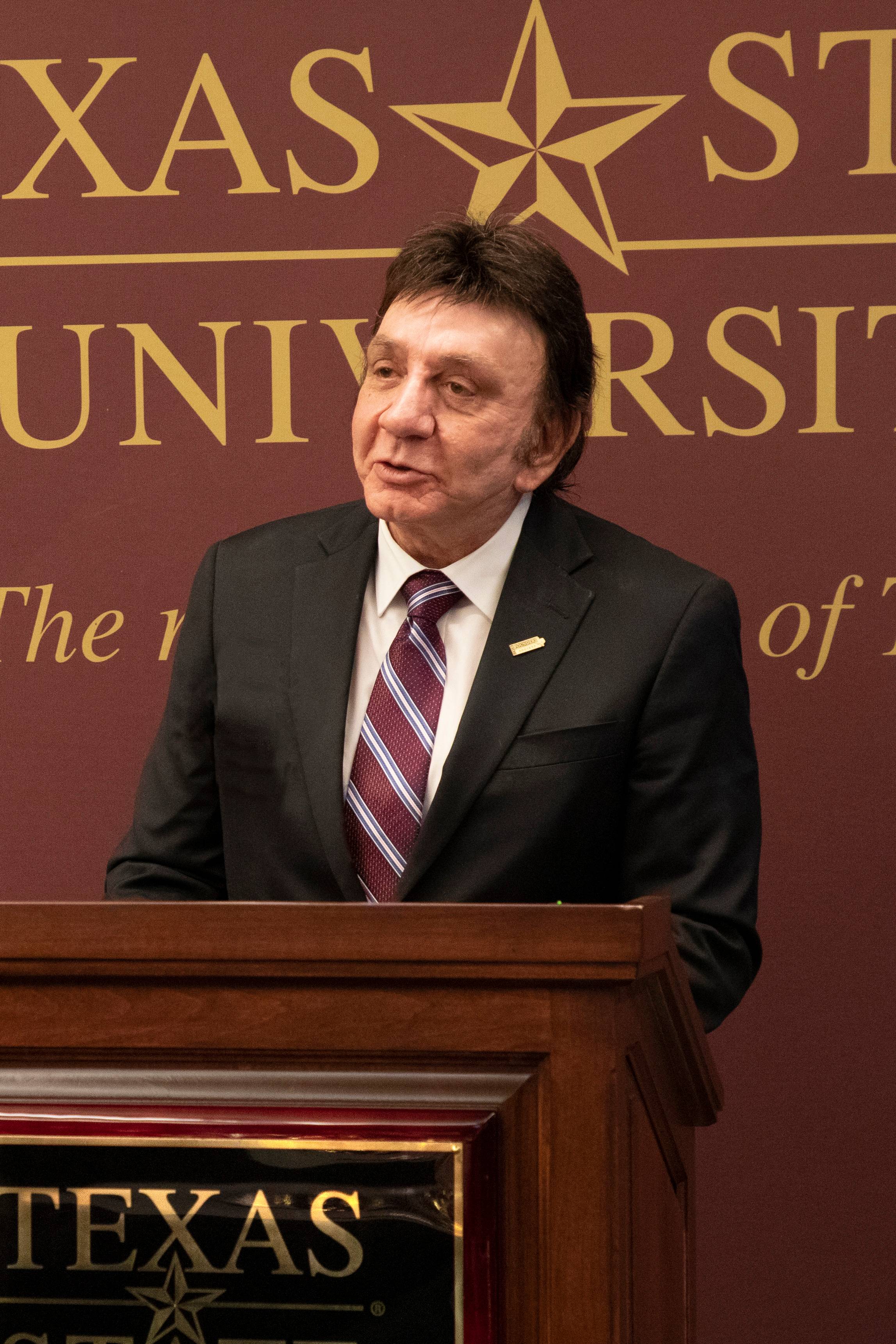 Richard Castro speaking at a Texas State event.