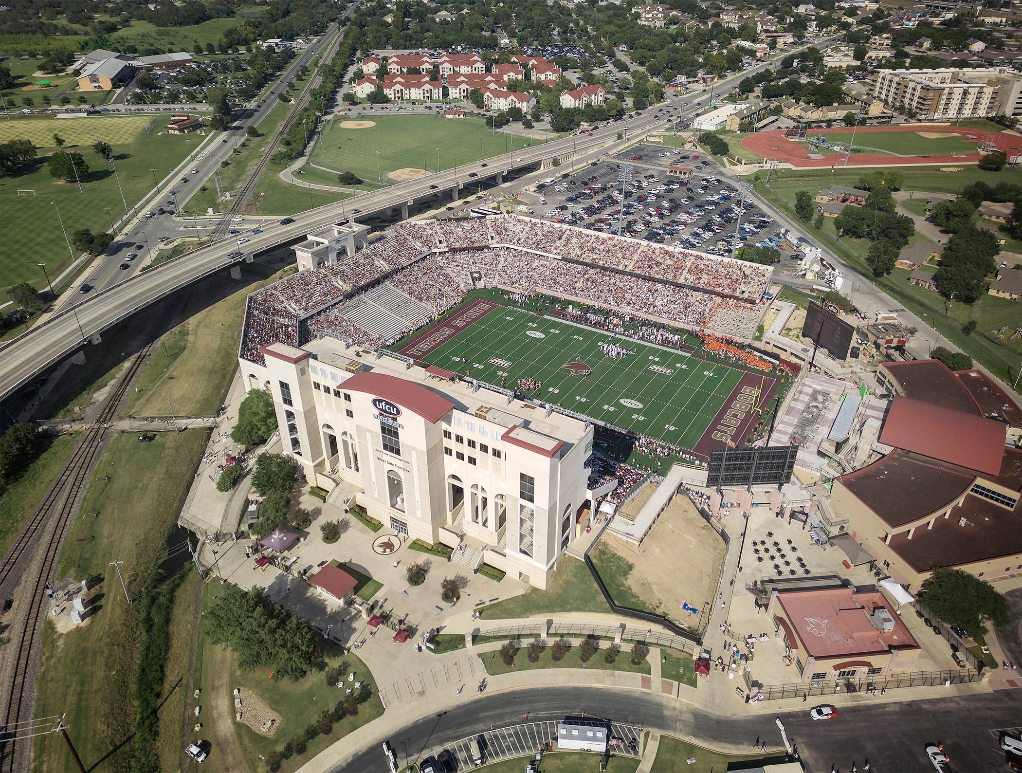 Aerial view of the newly-named UFCU Stadium during a football game.