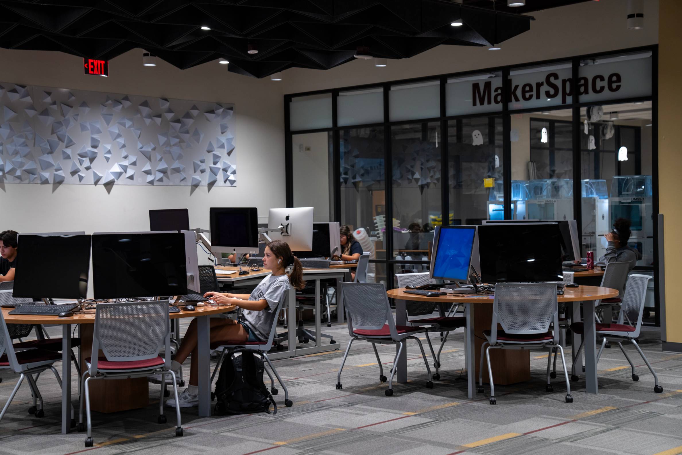 Students work in the Alkek One Maker Space in the Alkek Library.