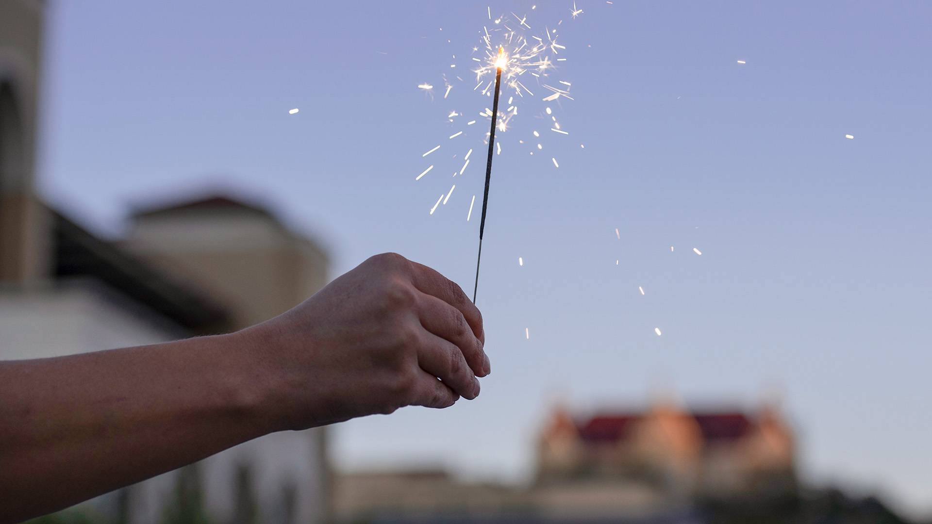 a person holding a sparkler