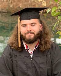 Toby Brinlee wearing his graduation regalia.