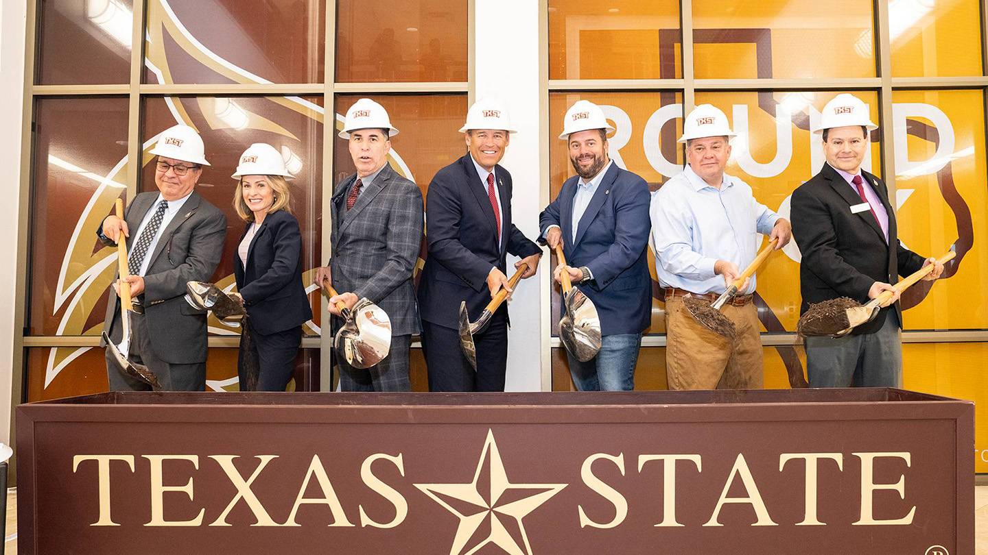 President Kelly Damphousse poses for a photo with several TXST staff members while turning dirt at the Esperanza Hall groundbreaking ceremony.