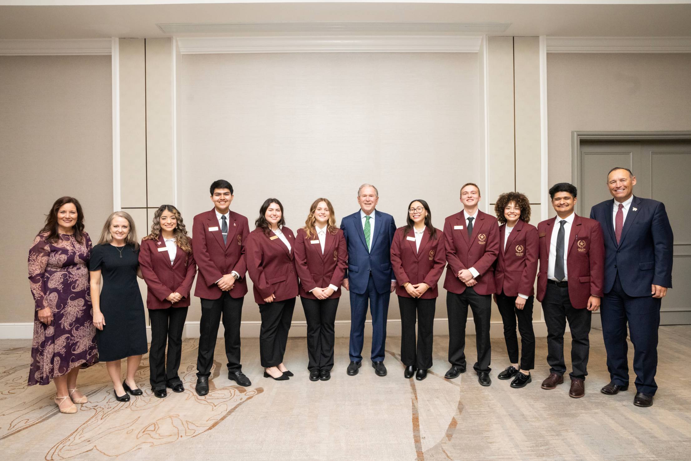 a group of people posing for a photo at a reception