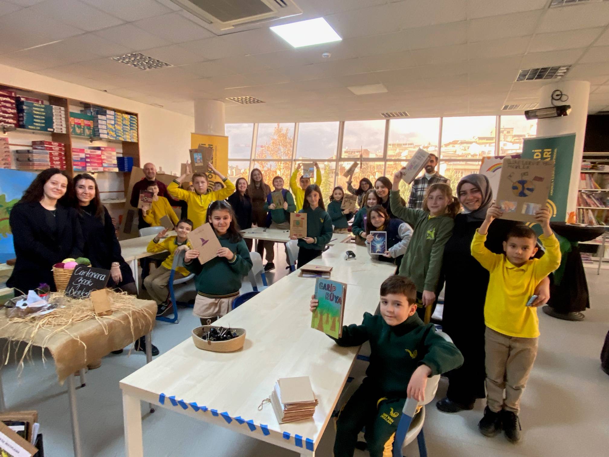 Students showing off books