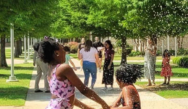 Young patients having fun with a sprinkler