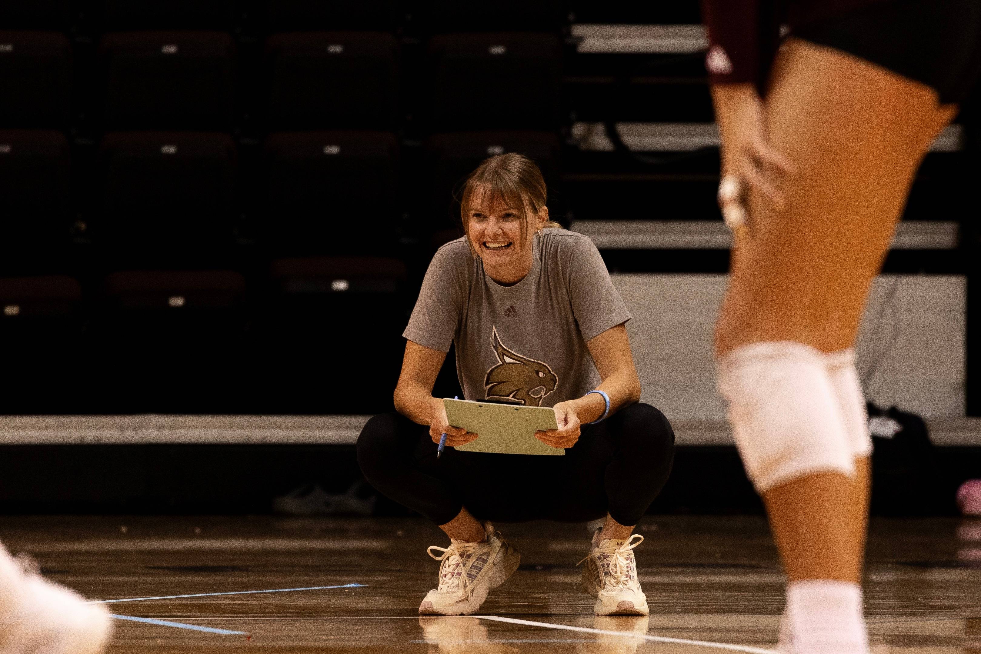 Charli coaching volleyball