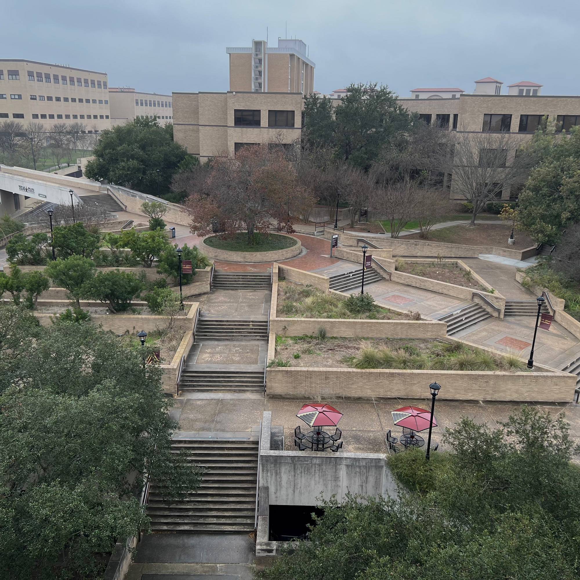 Texas State University campus buildings and empty spaces without students on a rainy day