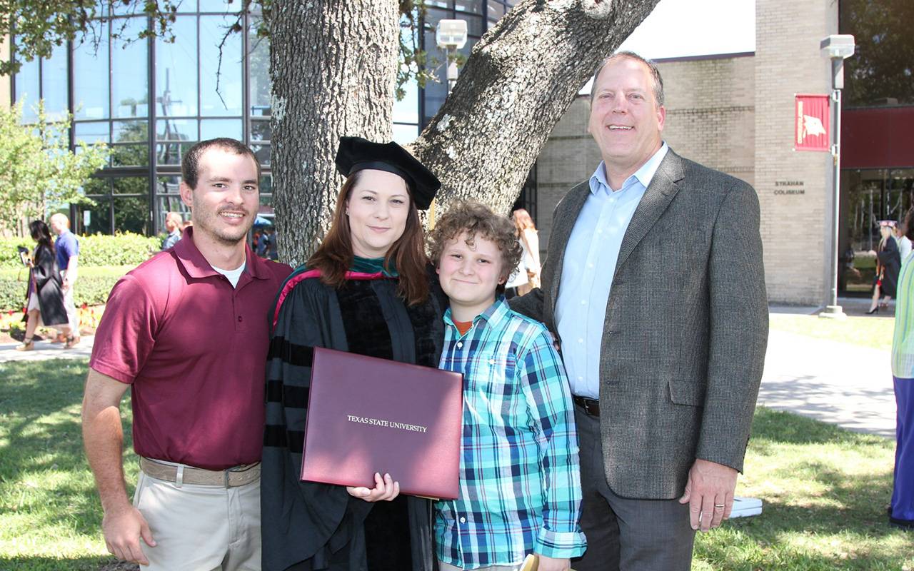 The Green family poses for a picture at TXST.