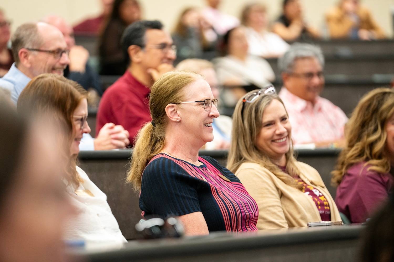 Texas State staff members listening to a presentation