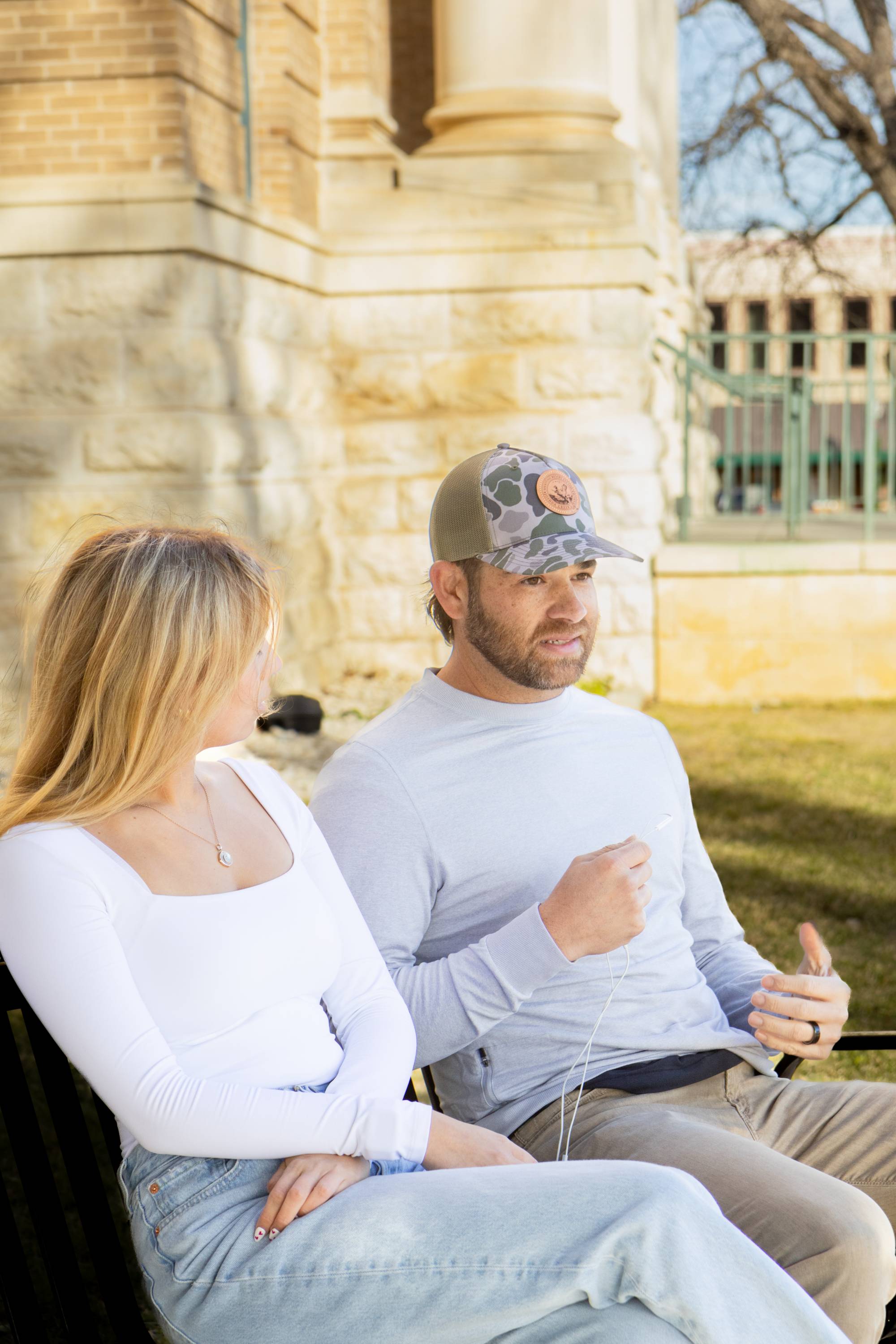 Bruce Kalmick sitting down on a bench with interviewer Cadyn Perkins being videographer by Jamian Lebron 