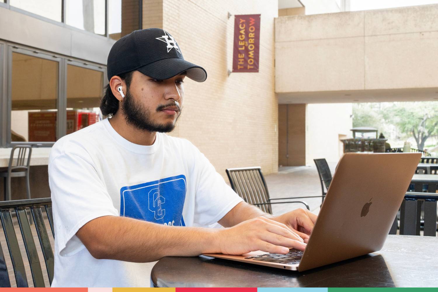 A student typing on a laptop