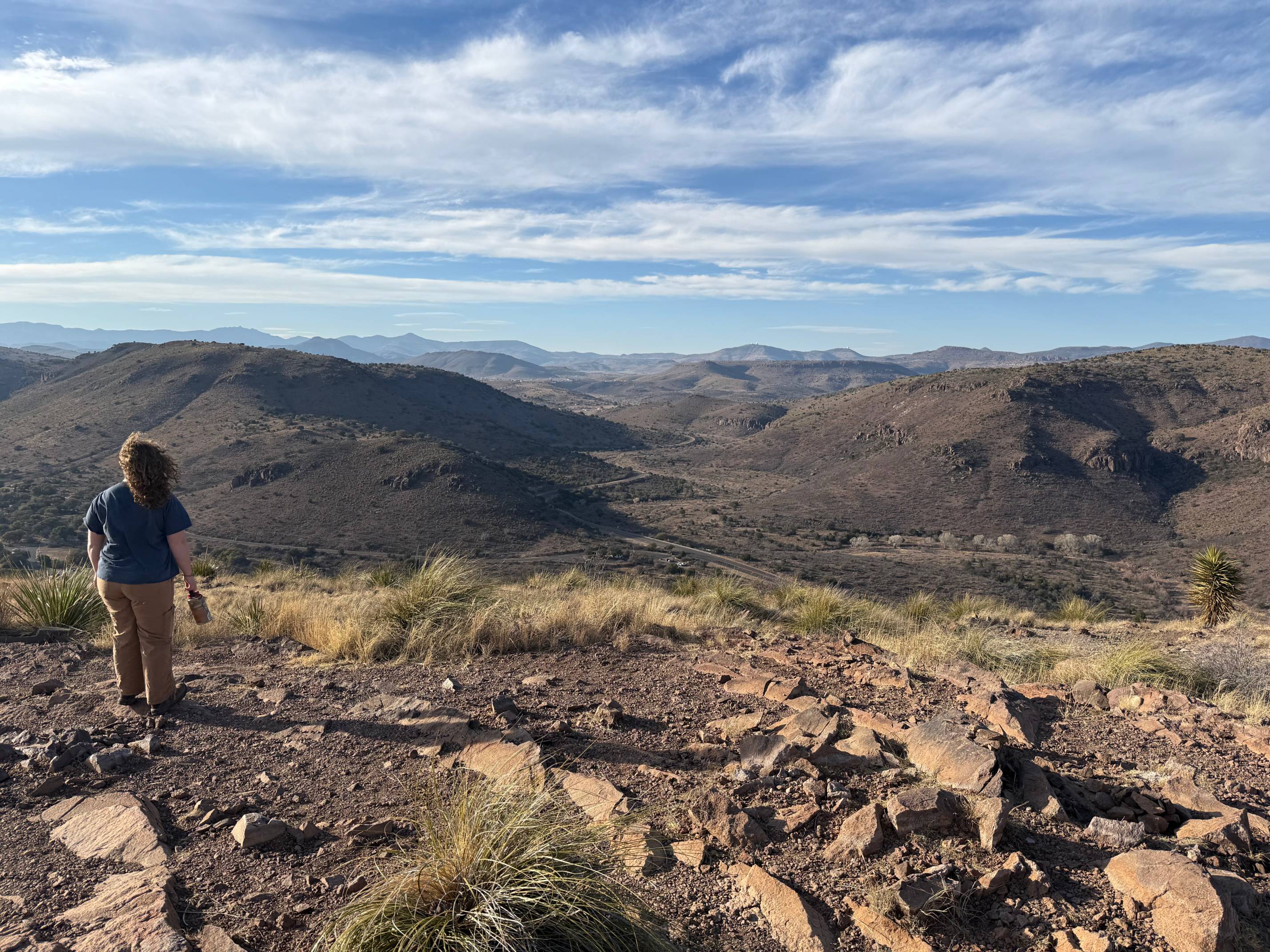 Student hiking with mountain landscape