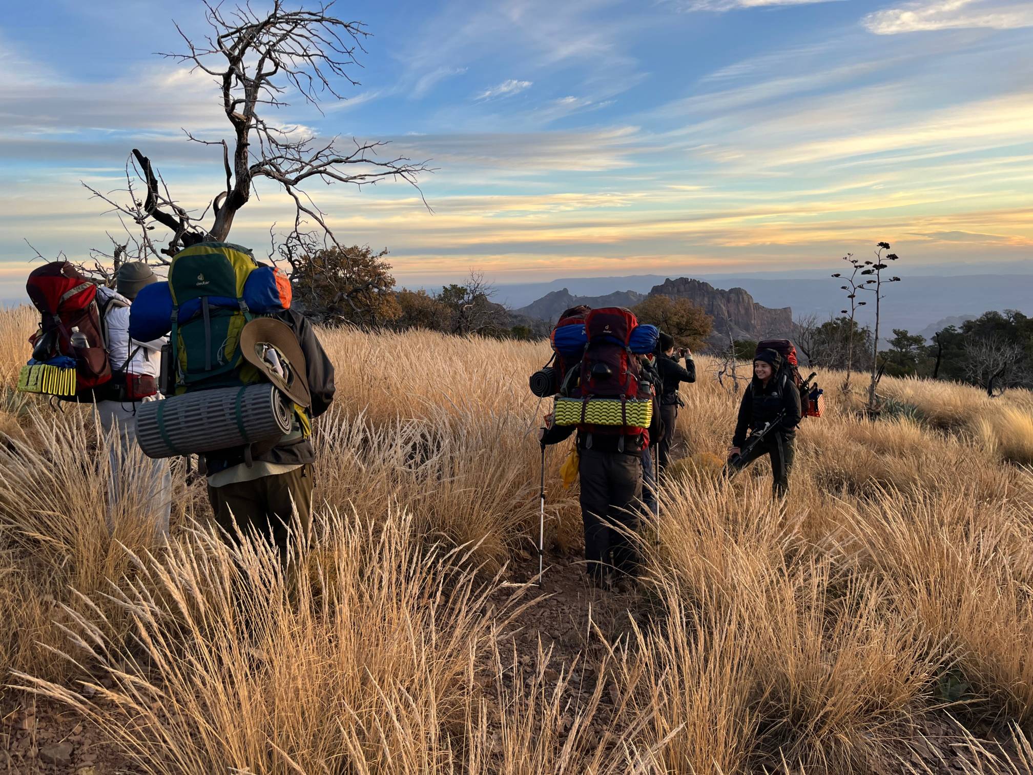 Students hiking with backpacks
