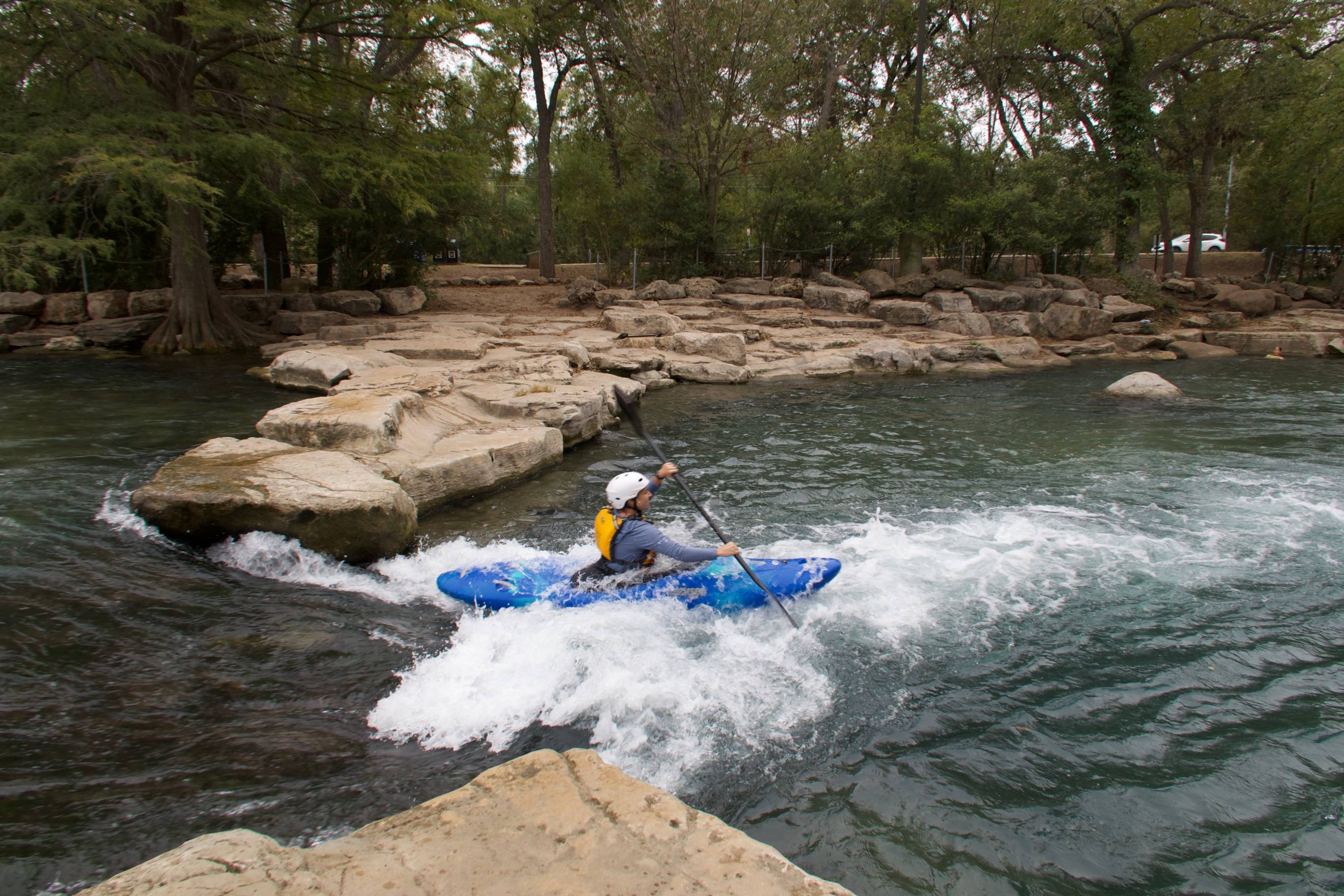 Students in whitewater kayaks