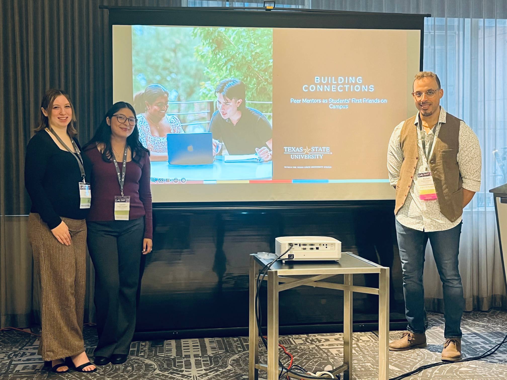 Two peer mentors and the program director presenting at a national conference.