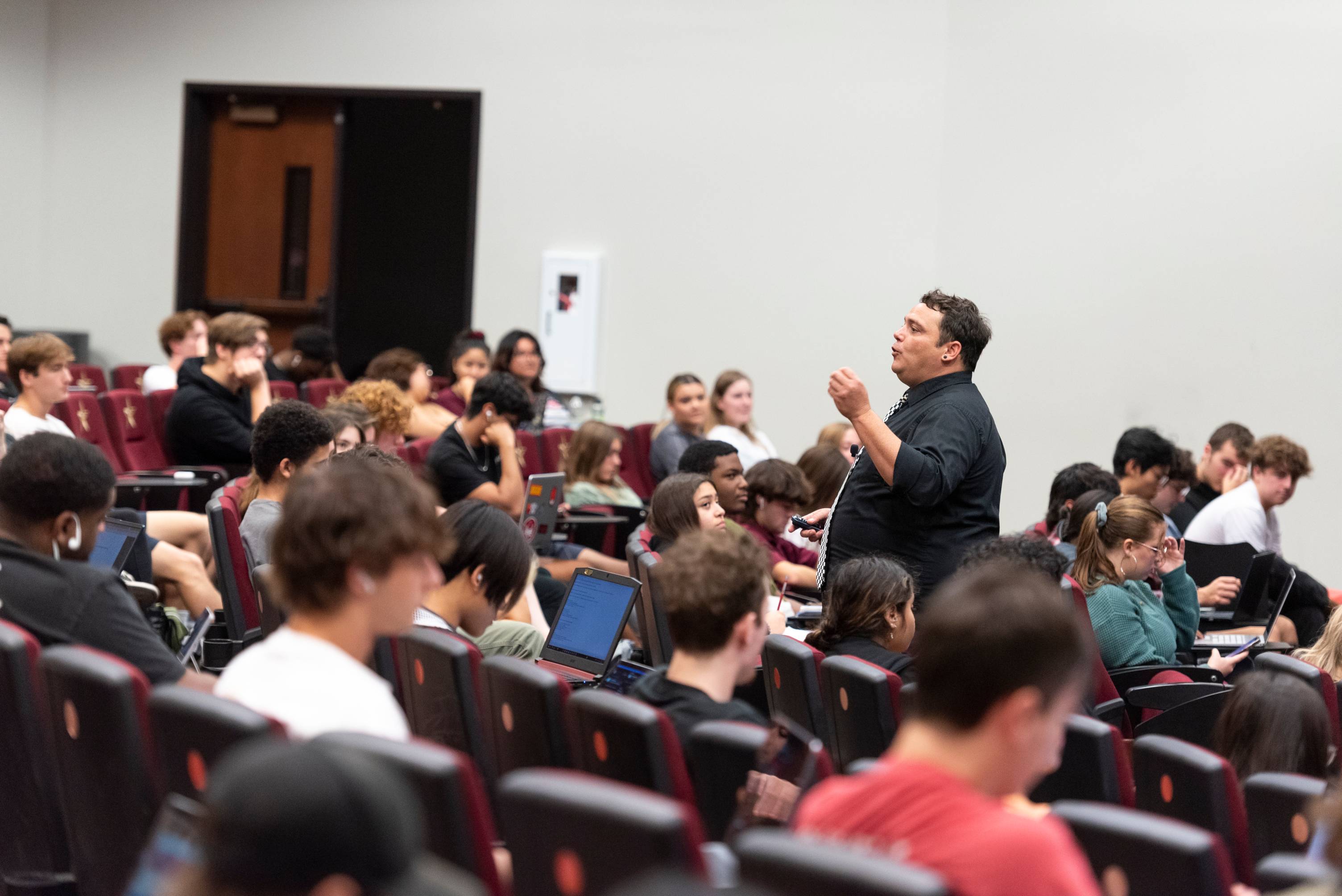 Professor in lecture hall.