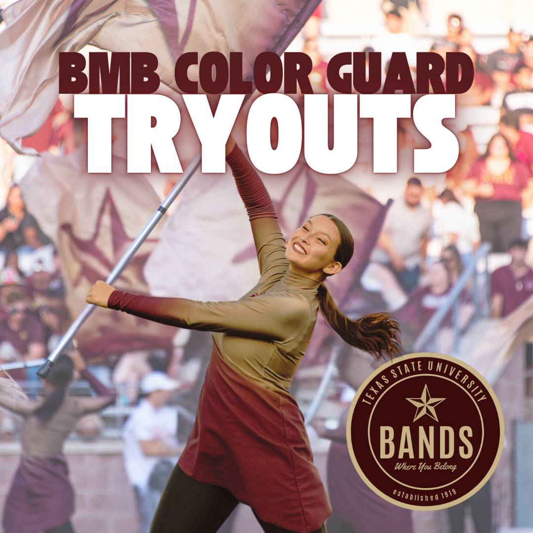 Image of Color Guard member spinning a flag on the field at a game