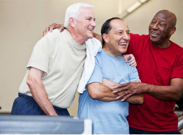 three men laughing together