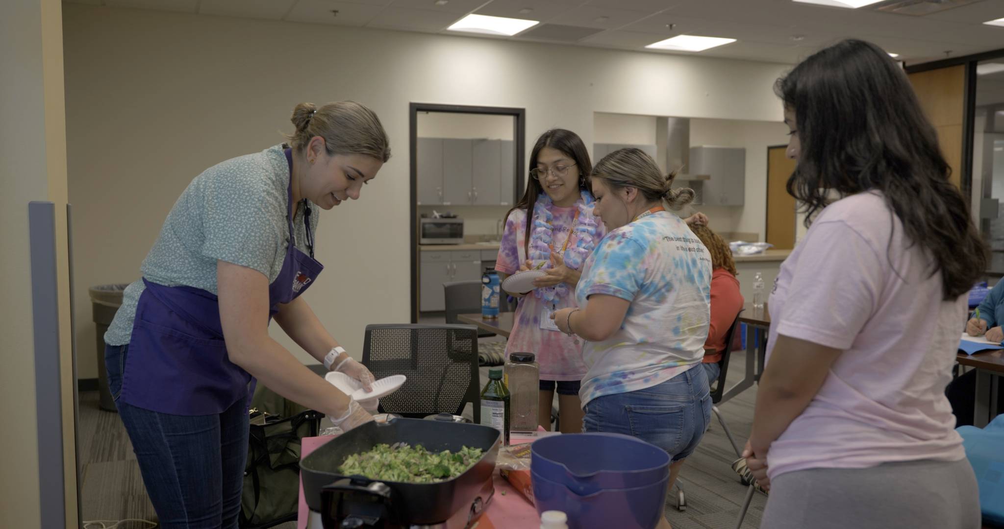 SR/SF volunteer working with adolescents at Summer Academy