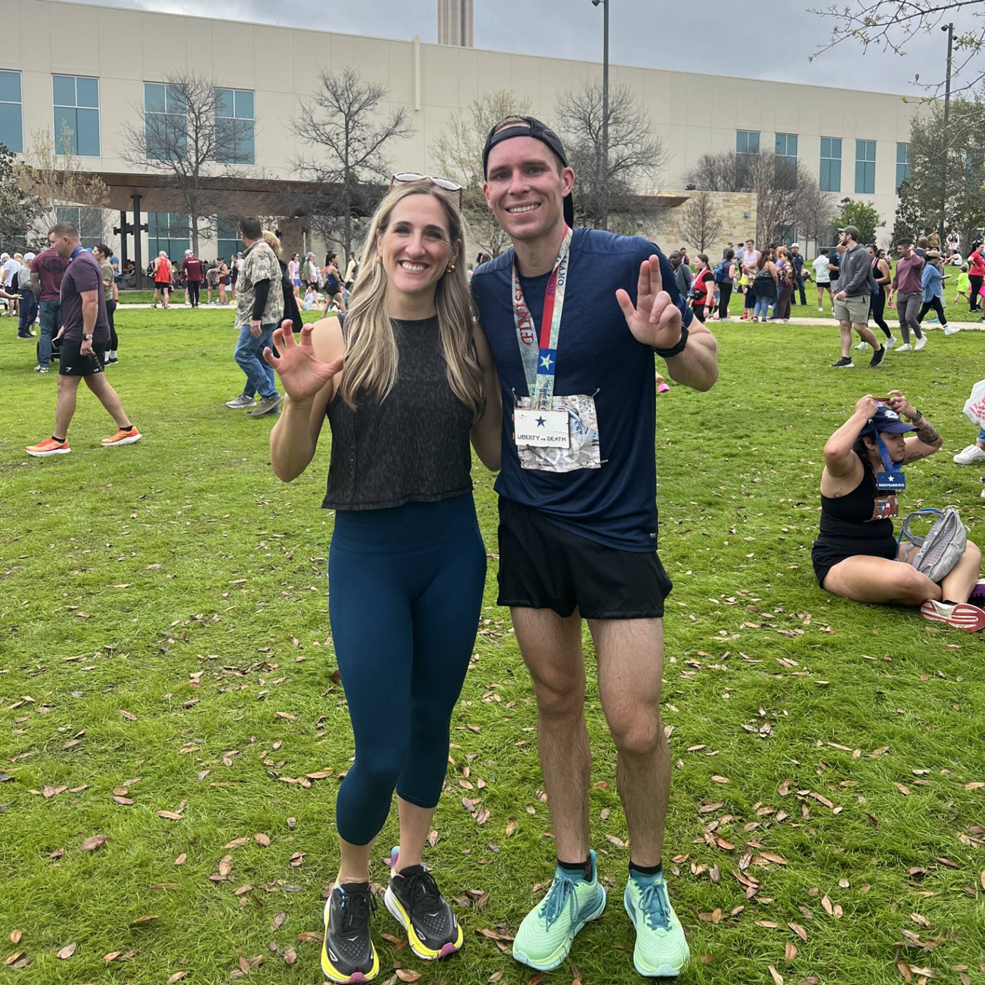 man and woman pose for camera after race