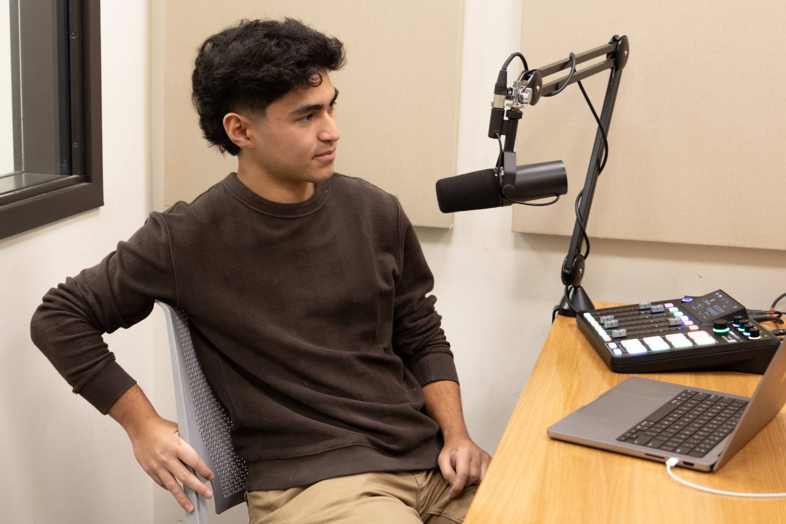 Aaron Soltani recording podcast for the CIE in podcast recording room 