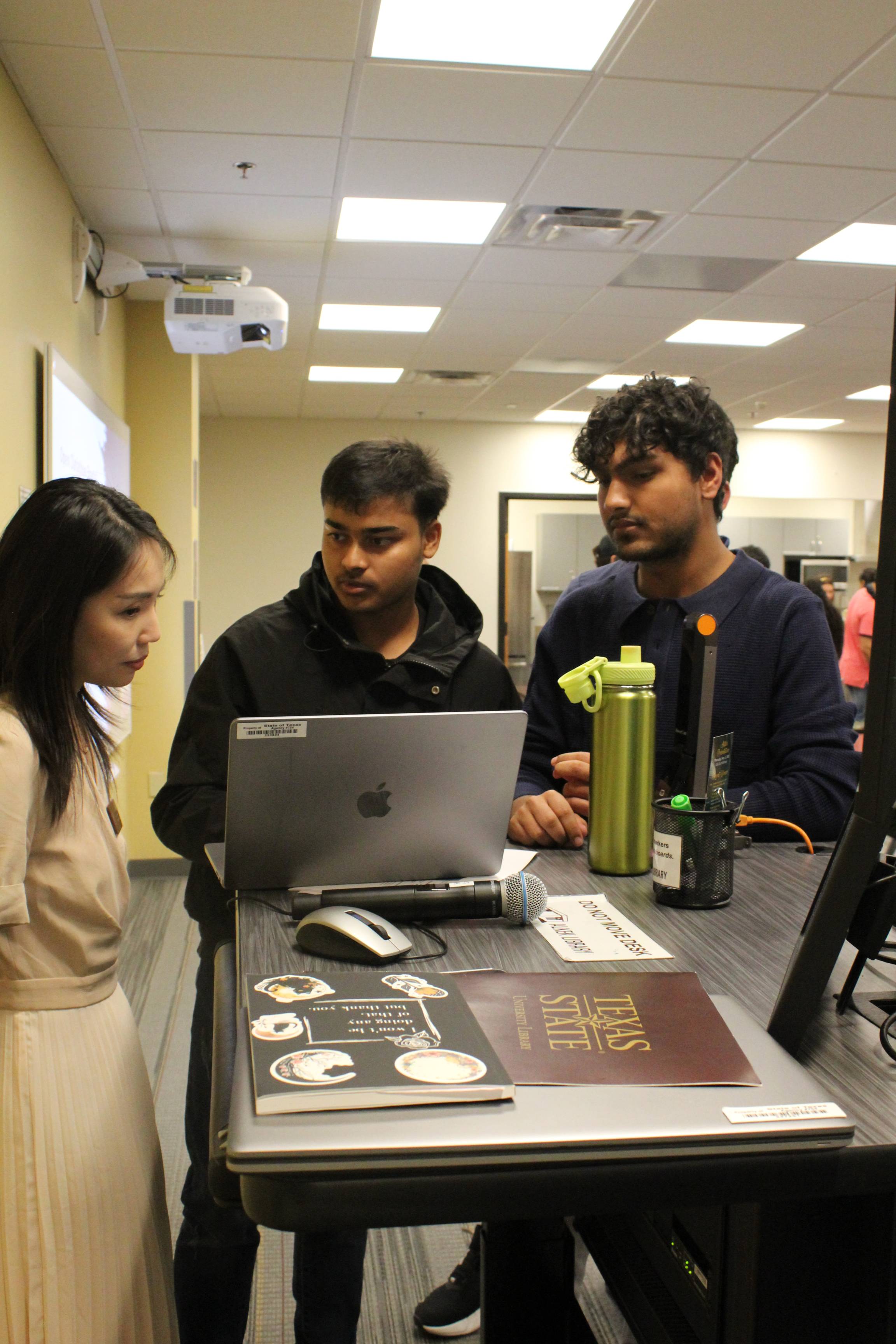 Students consult with Xuan Zhou