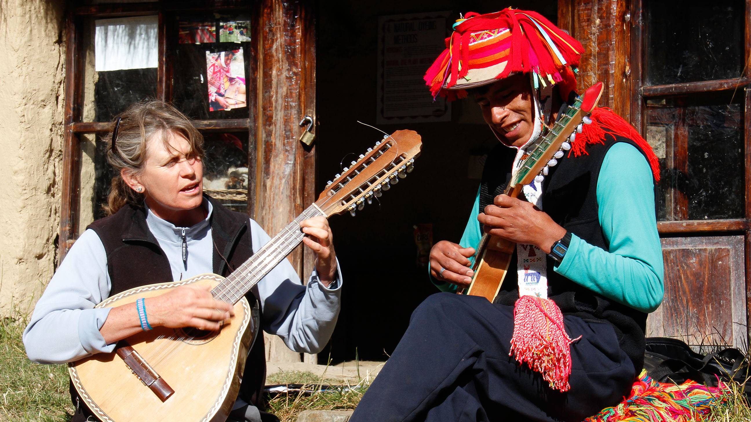 Wissler (left) plays the 16-string bandurria with musician Cristobal Quispe.