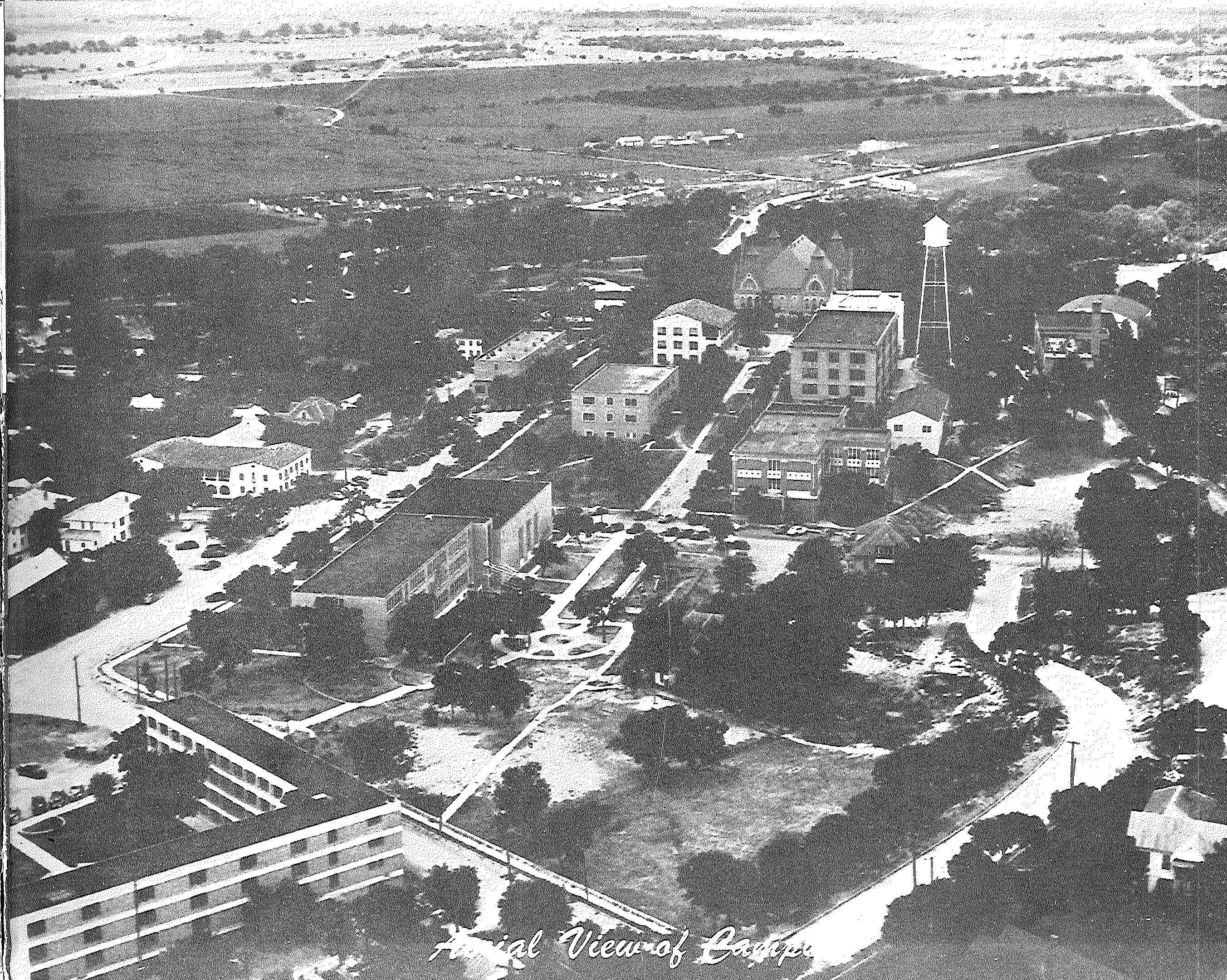 Black and white photograph of old plans for the university