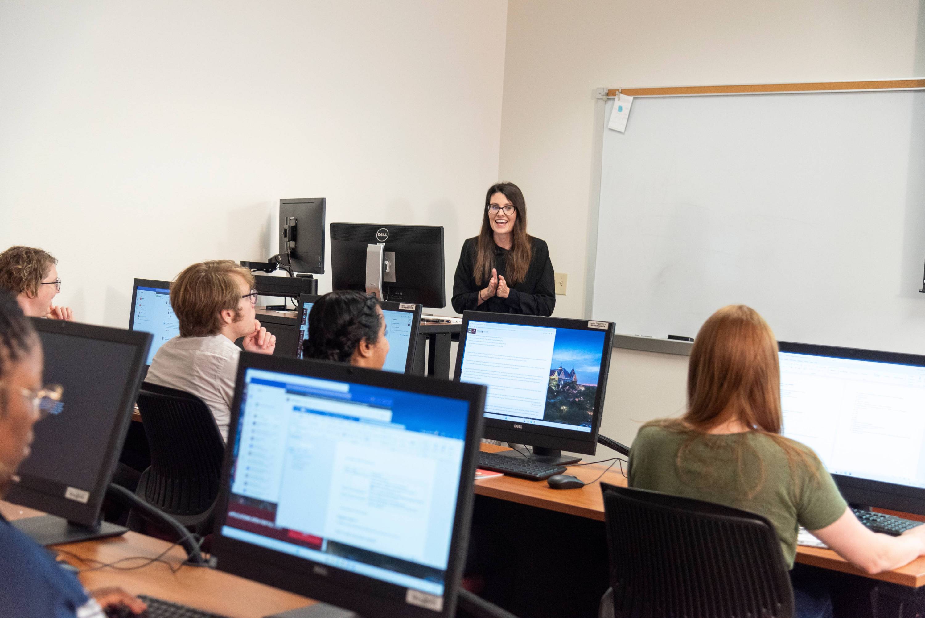 Professor lecturing a class of students.