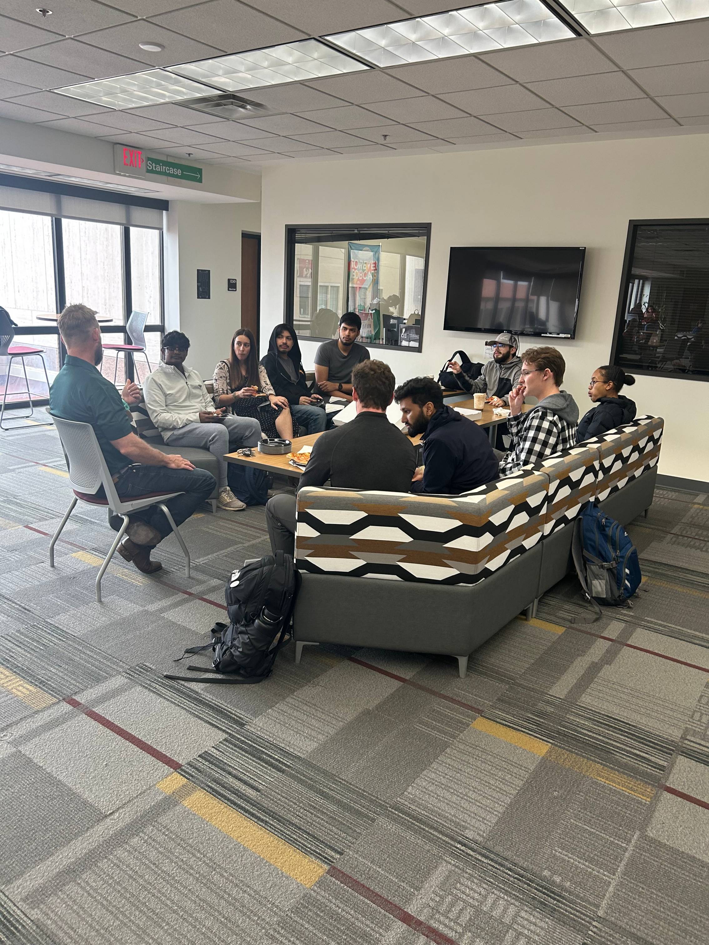 Students gathered around the CIE gathering space 