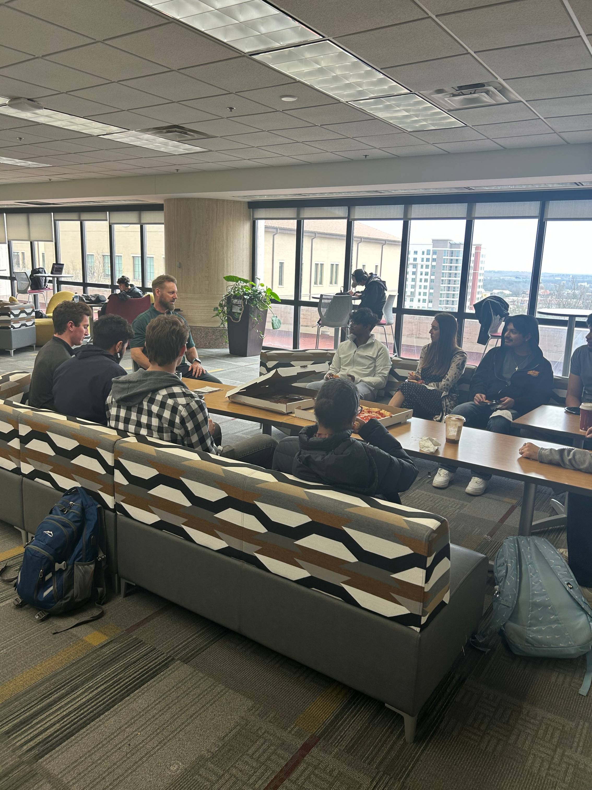 Students gathered around the CIE gathering space 