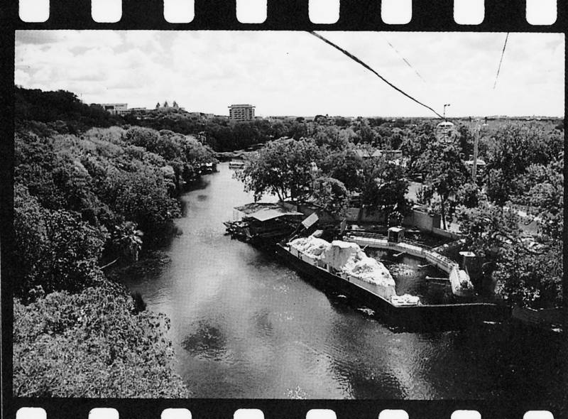 black and white photograph of a boat at Aquarena Springs on the lake