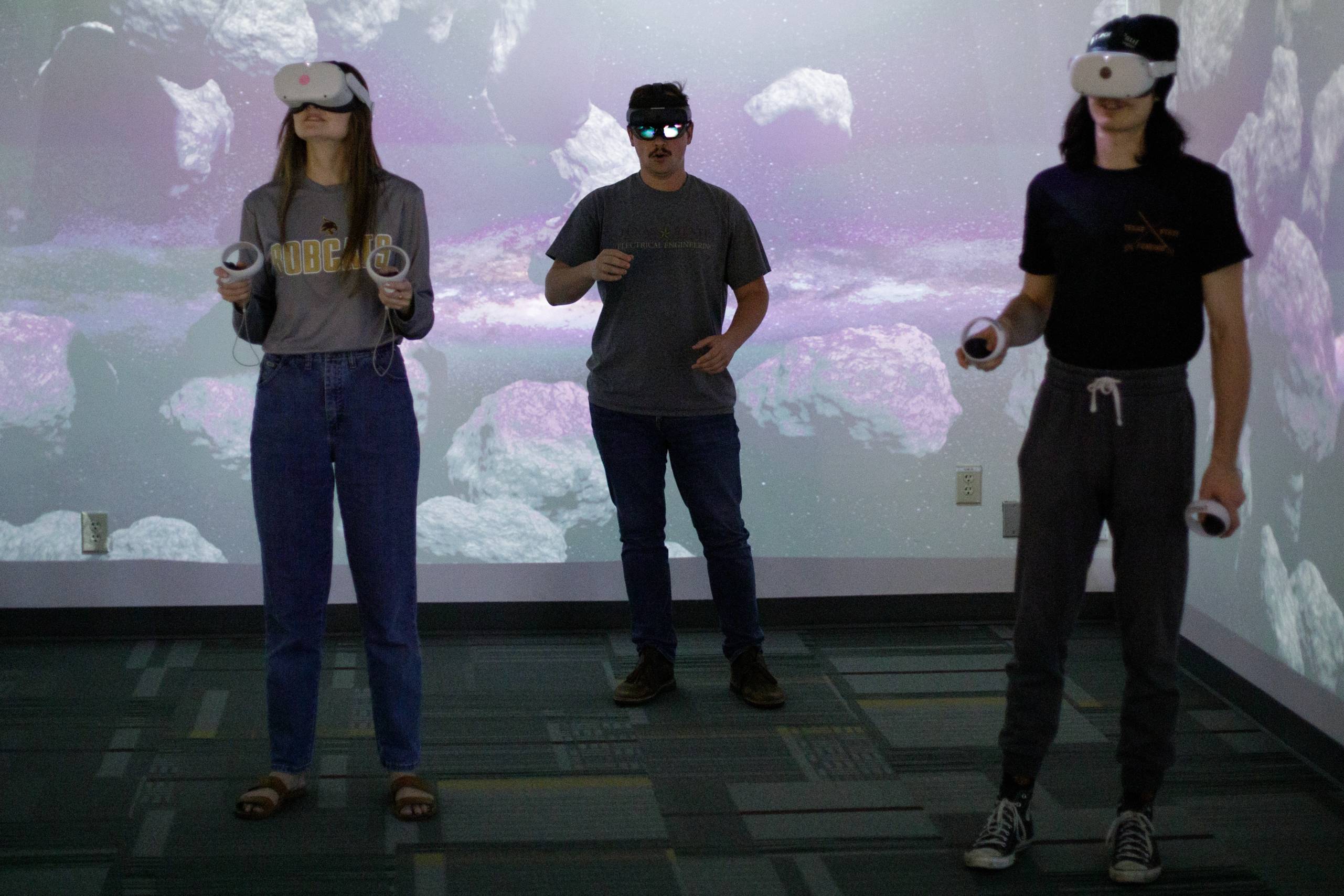 people interacting with the virtual reality devices