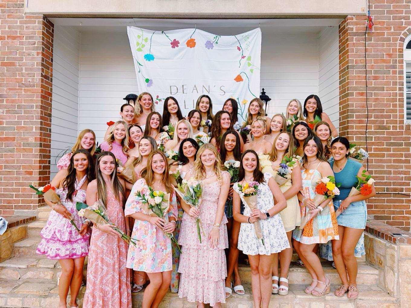 Women posing with flowers
