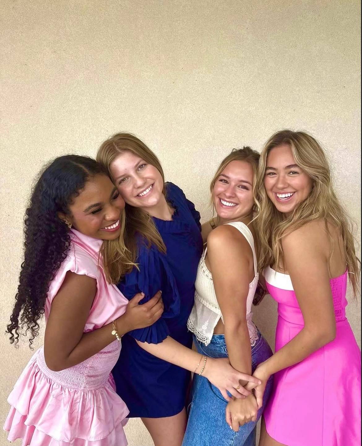 Four women posing for a photo together