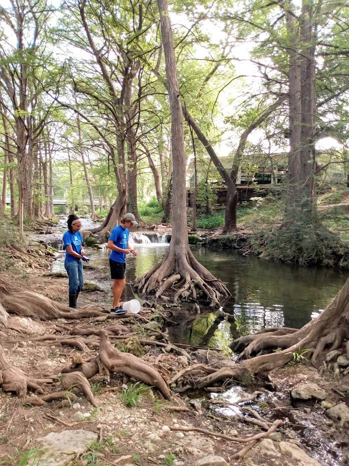 researchers collecting water samples