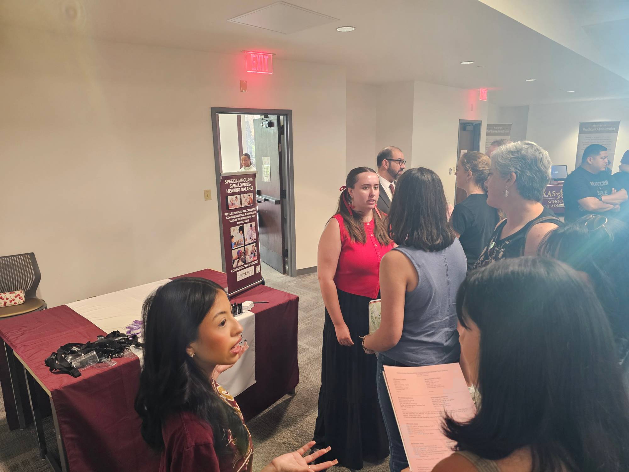 Dr. Farzan and CDIS students speaking with recently admitted students in the San Marcos Campus.
