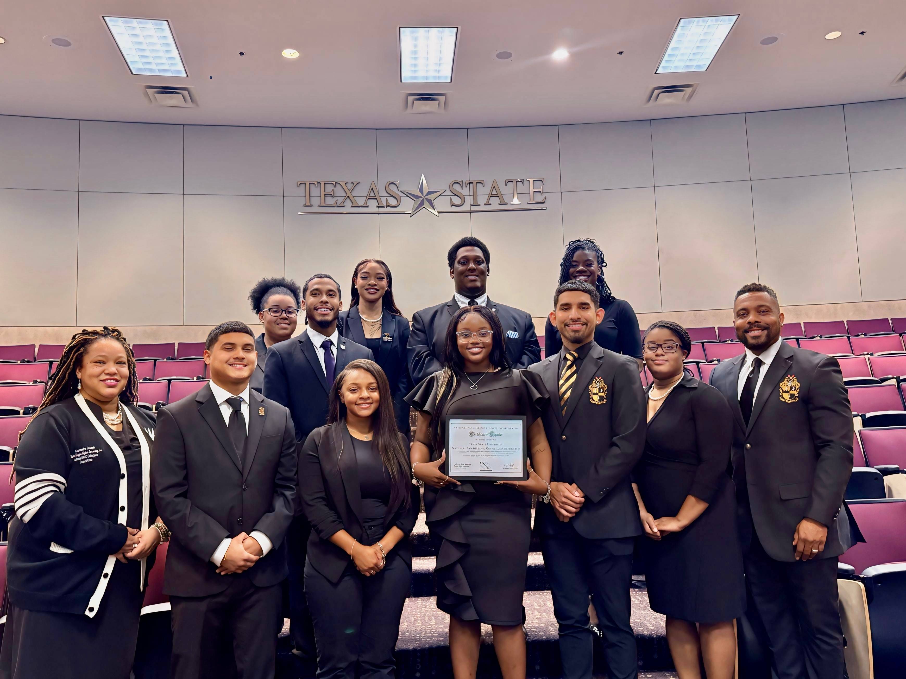 Students posing with charter