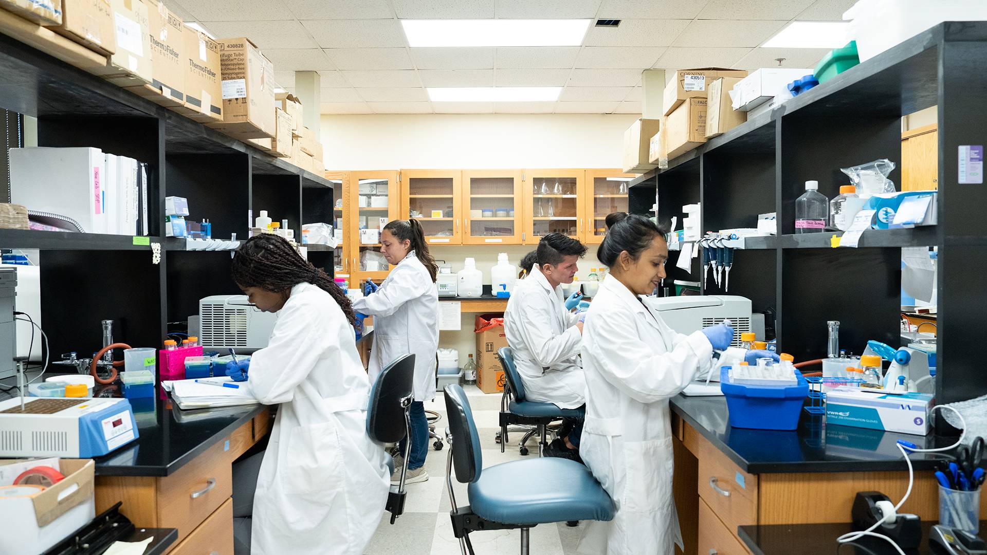 researchers in a lab