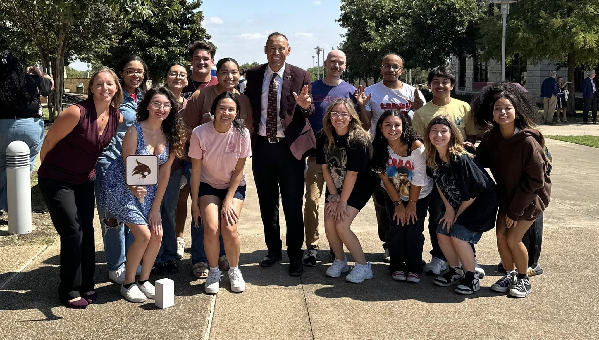 Students with the Texas State President on the Round Rock campus
