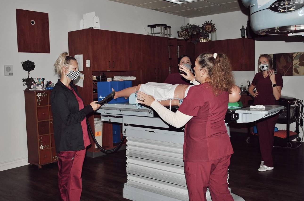 Students and clinical coordinator in clinic