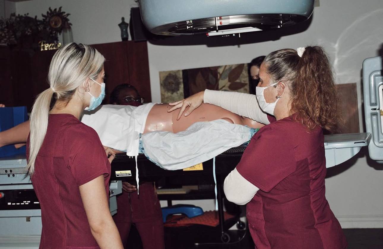 students in sim lab with clinical instructor
