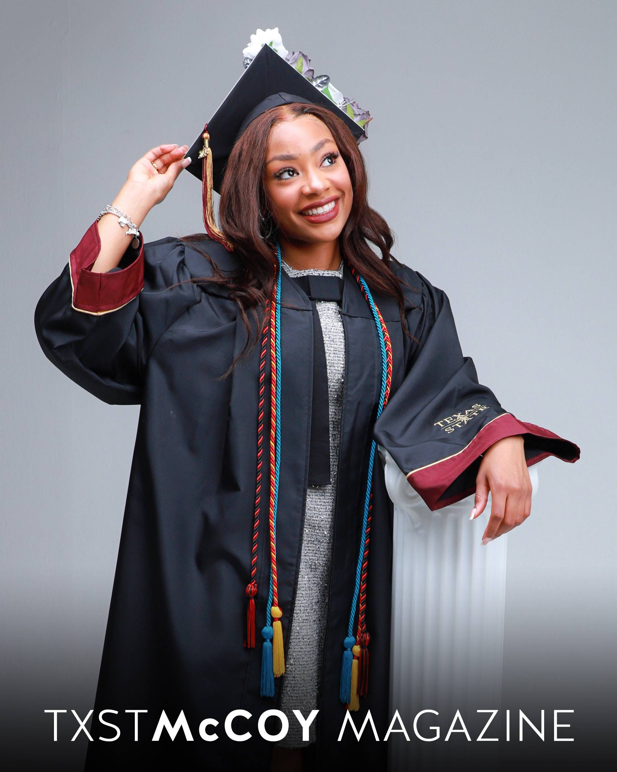 Allonna Beasley smiling in graduation regalia