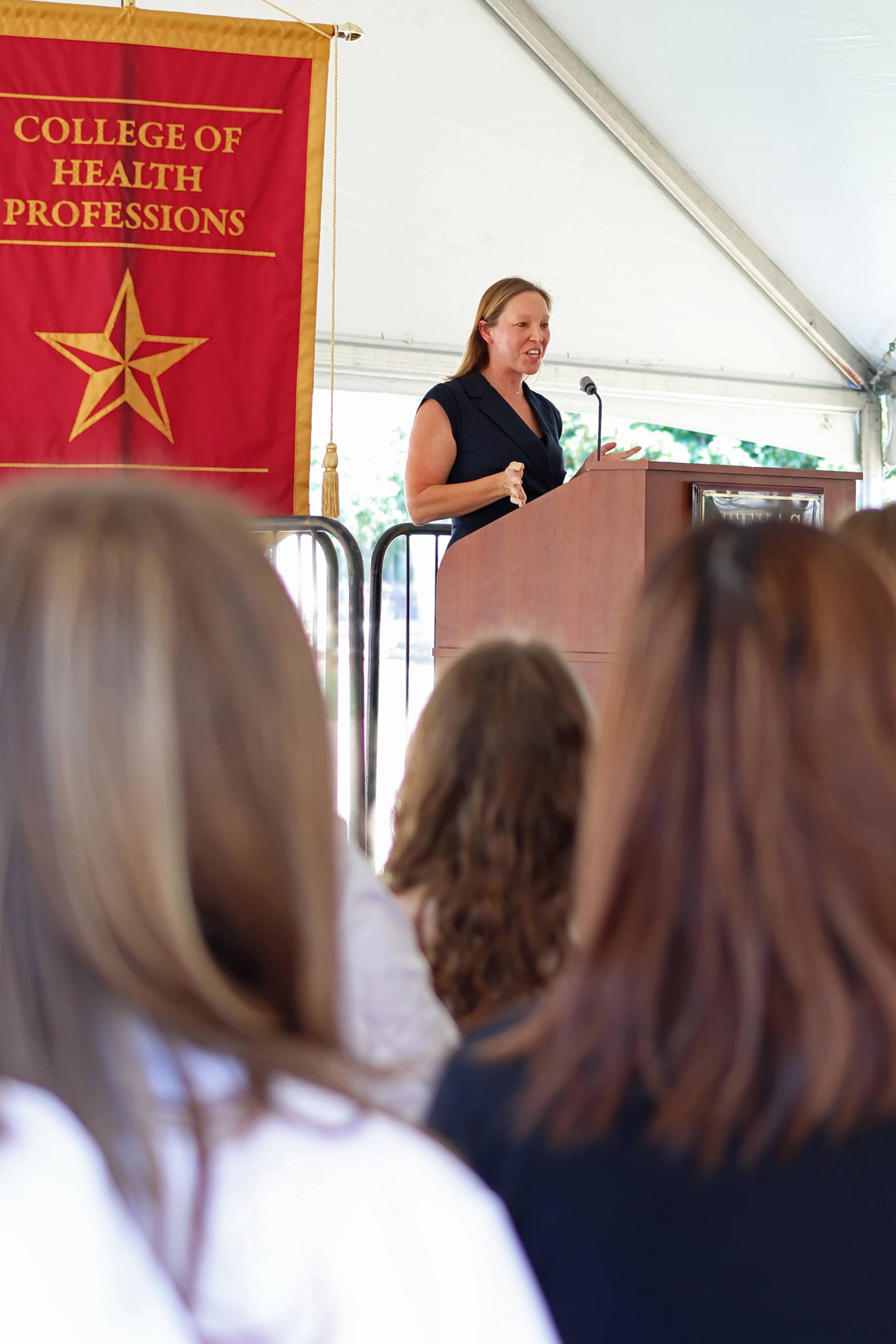 Dr. Trad speaking at the pinning ceremony