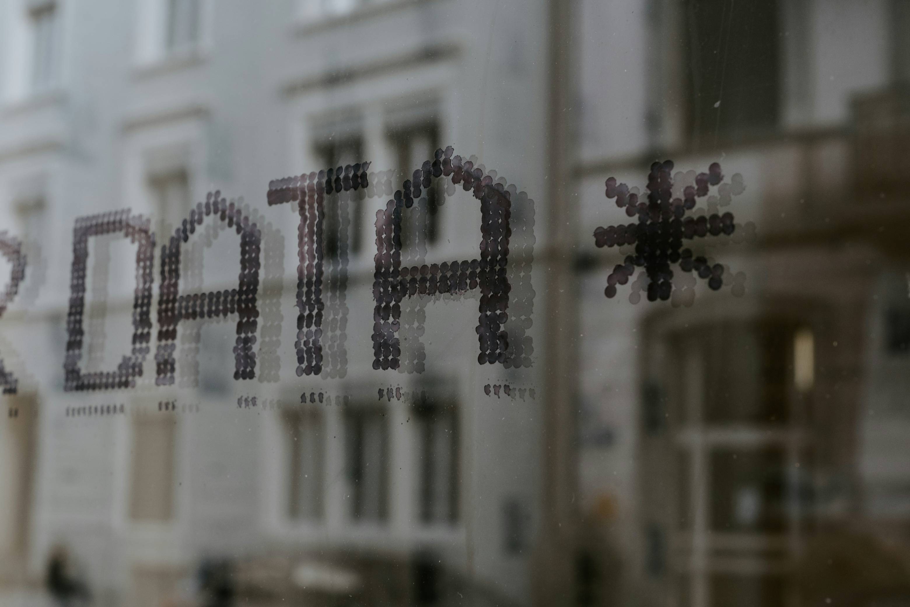 An Image of text named data on a glass