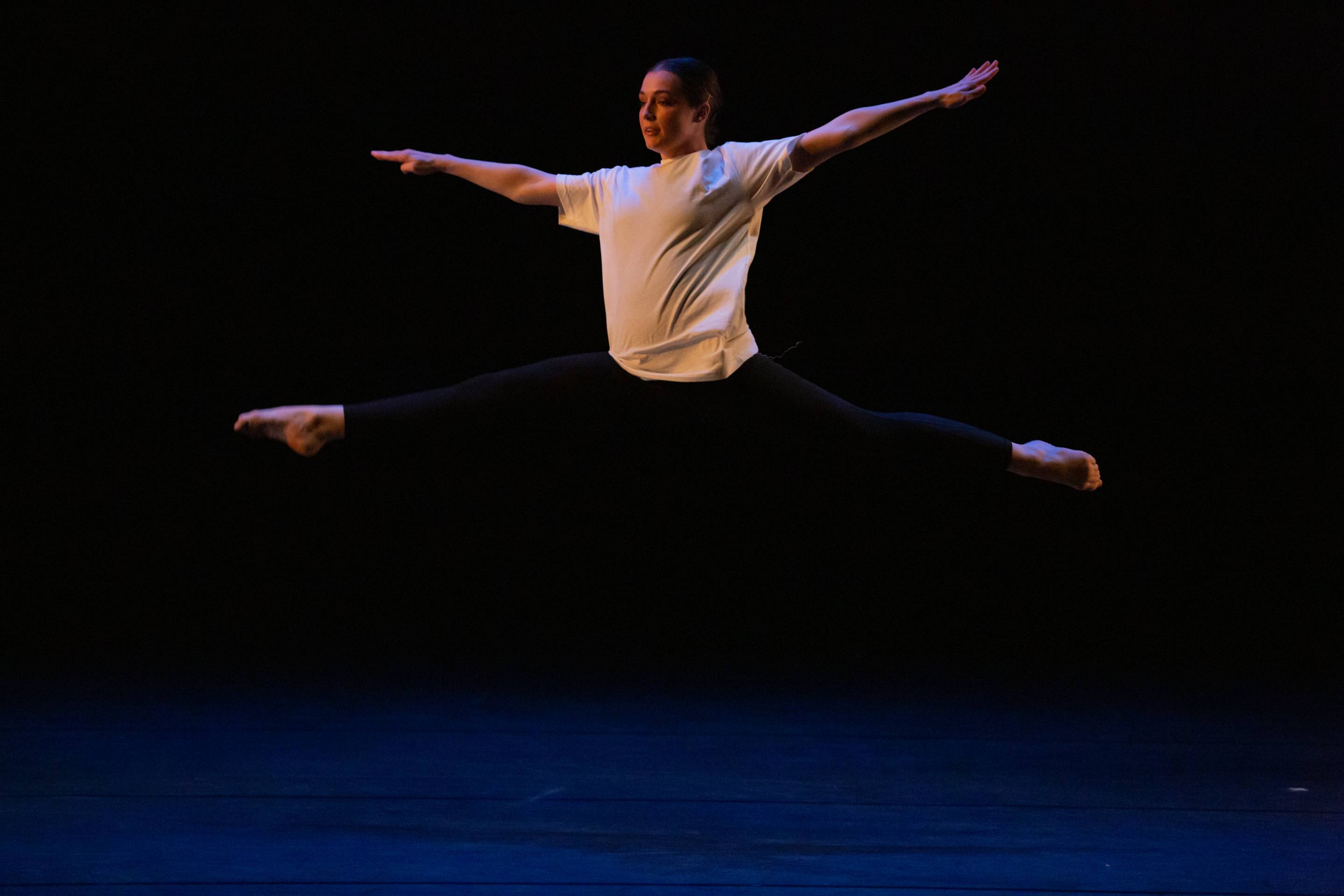 a stage with a student dancing