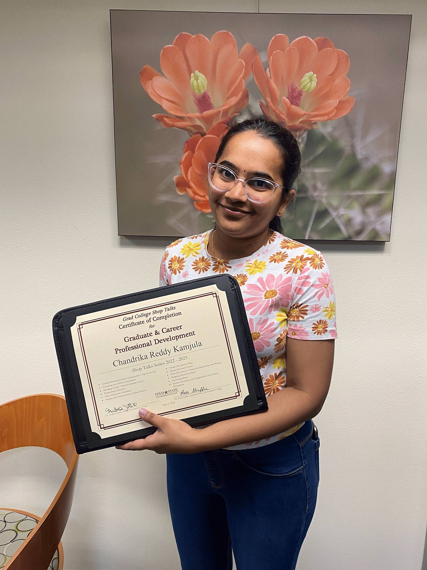 Chandrika Reddy Kamjula holding her Shop Talks Certificate of Completion